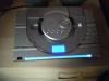 crown cd player and speakers. silver with blue light.